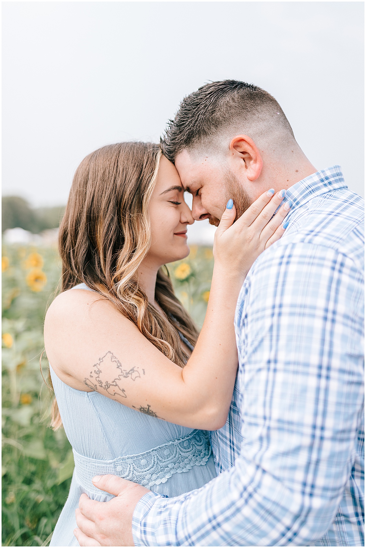 sunflower field maternity portraits